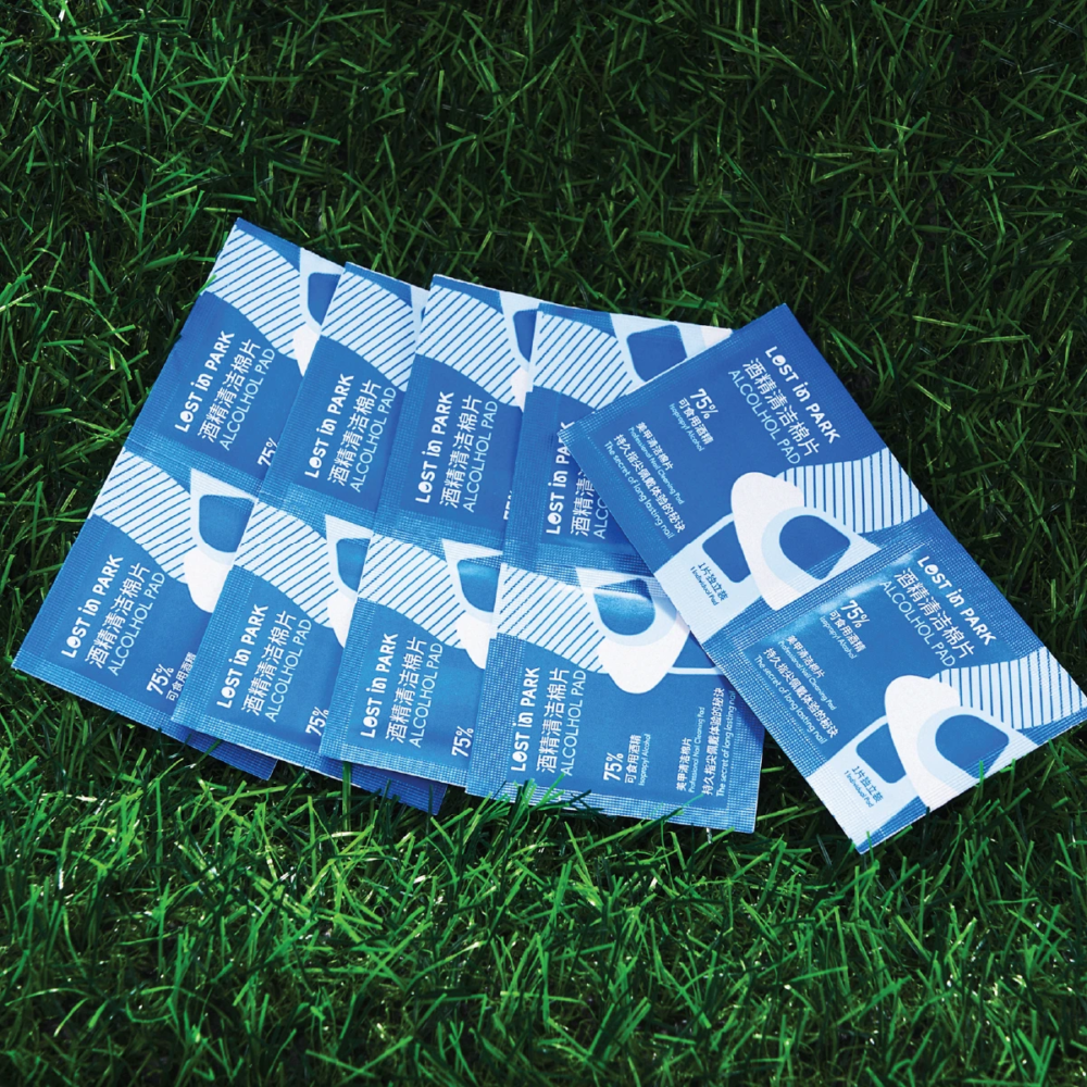 multiple alcohol pad packets on grass