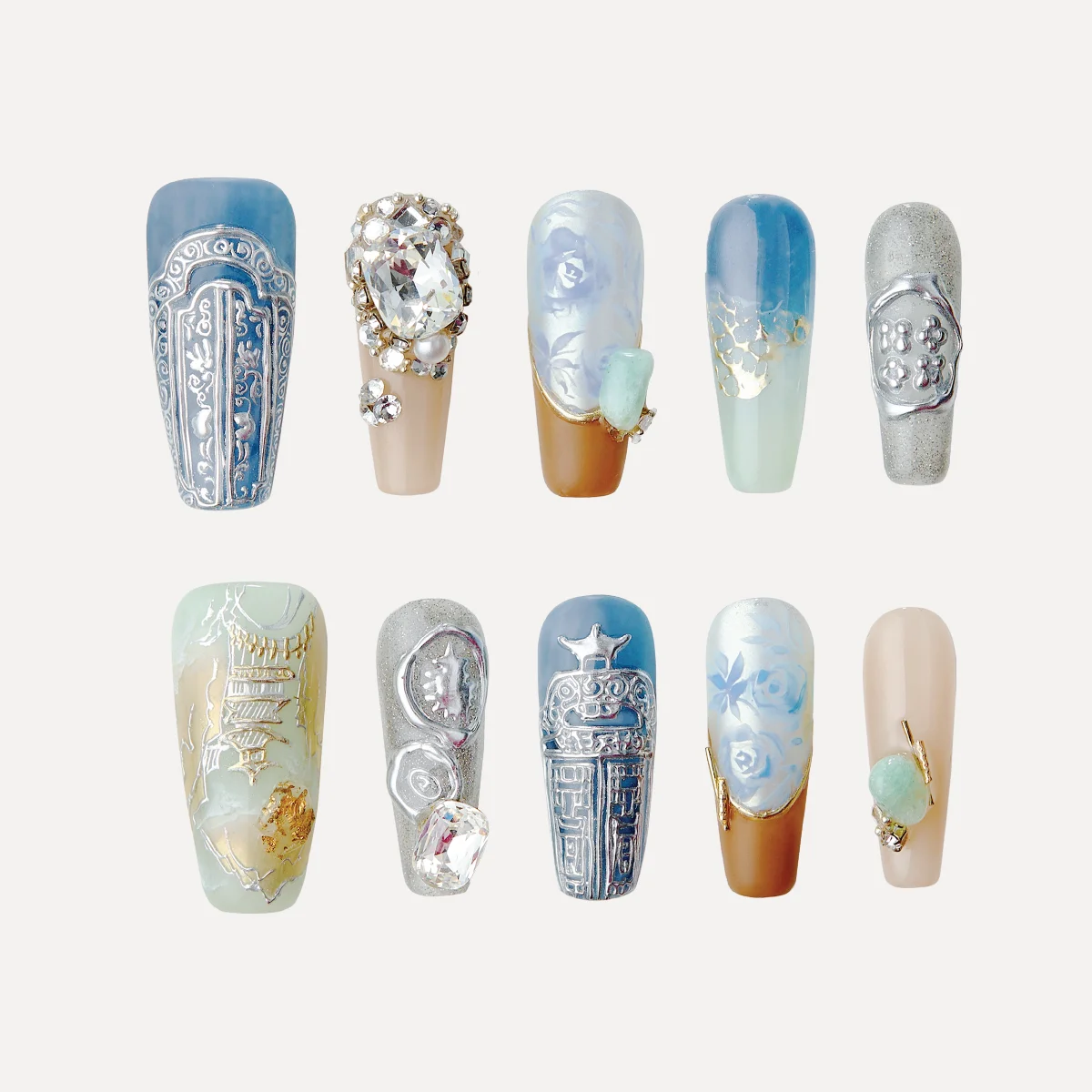 Metasensory press-on nails with futuristic textures, glossy finishes, and multidimensional sculptural details