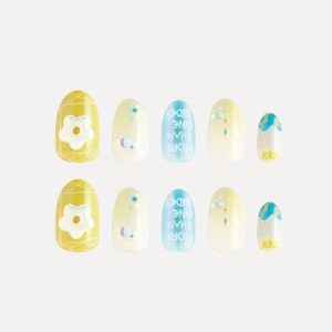 Flat lay of yellow and blue decorative press-on nails with 3D flower charm and gradient patterns.