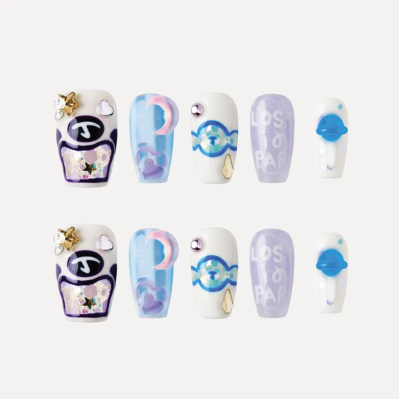 Blue Lollipop press-on nail set displayed flat, featuring candy motifs, pastel colors, and 3D embellishments.