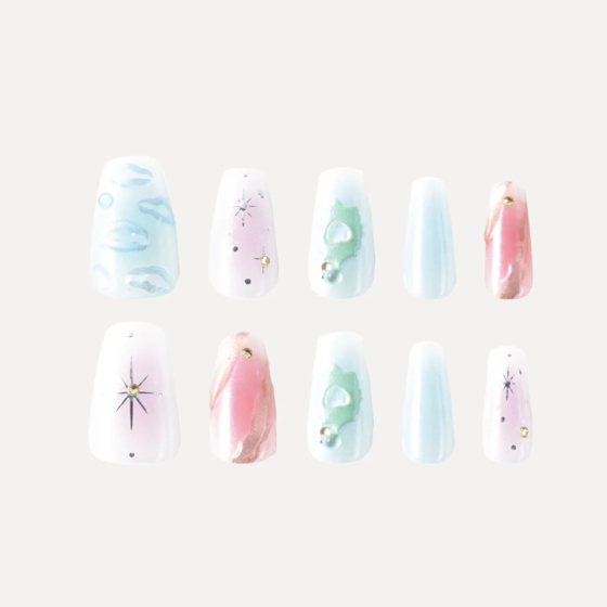 Full set of galaxy-inspired press-on nails in pink, blue, and white with star and pearl embellishments