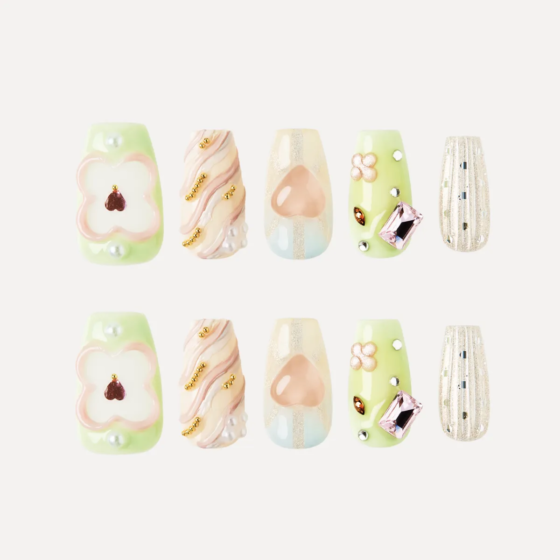 Full set of pastel floral and gemstone press-on nails in green, peach, and shimmer tones