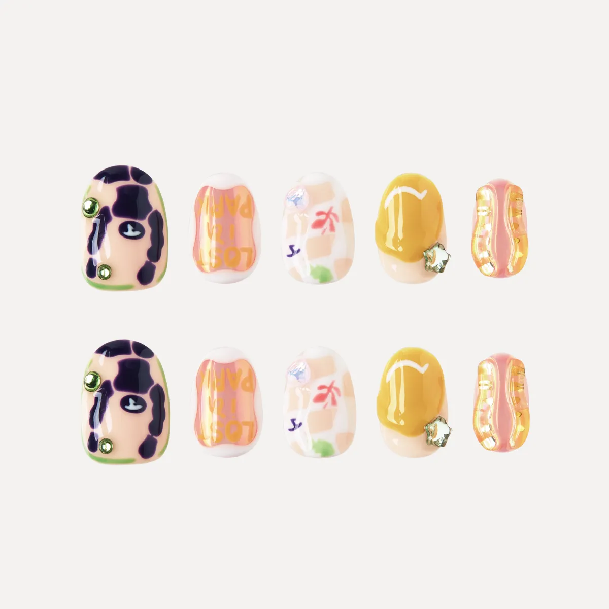 Flat lay of 10 short round press-on nails with colorful patternds