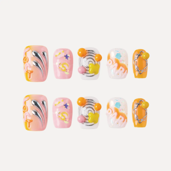 Flatlay of Lost in Park Honey Melody press-on nail set featuring 10 unique 3D candy-inspired designs in pink, white, orange, and silver with embellishments.