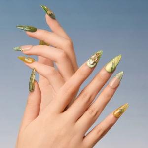 Full-hand view of Jade Gleam press-on nails in stiletto shape with gemstone and gold flower accents