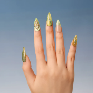 Front view of hand wearing Jade Gleam nails showcasing shimmering green and yellow patterns