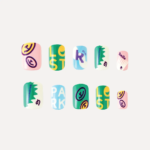 Flat lay of 10-piece Riotous Paradise press-on nail set featuring bold typography and symbols