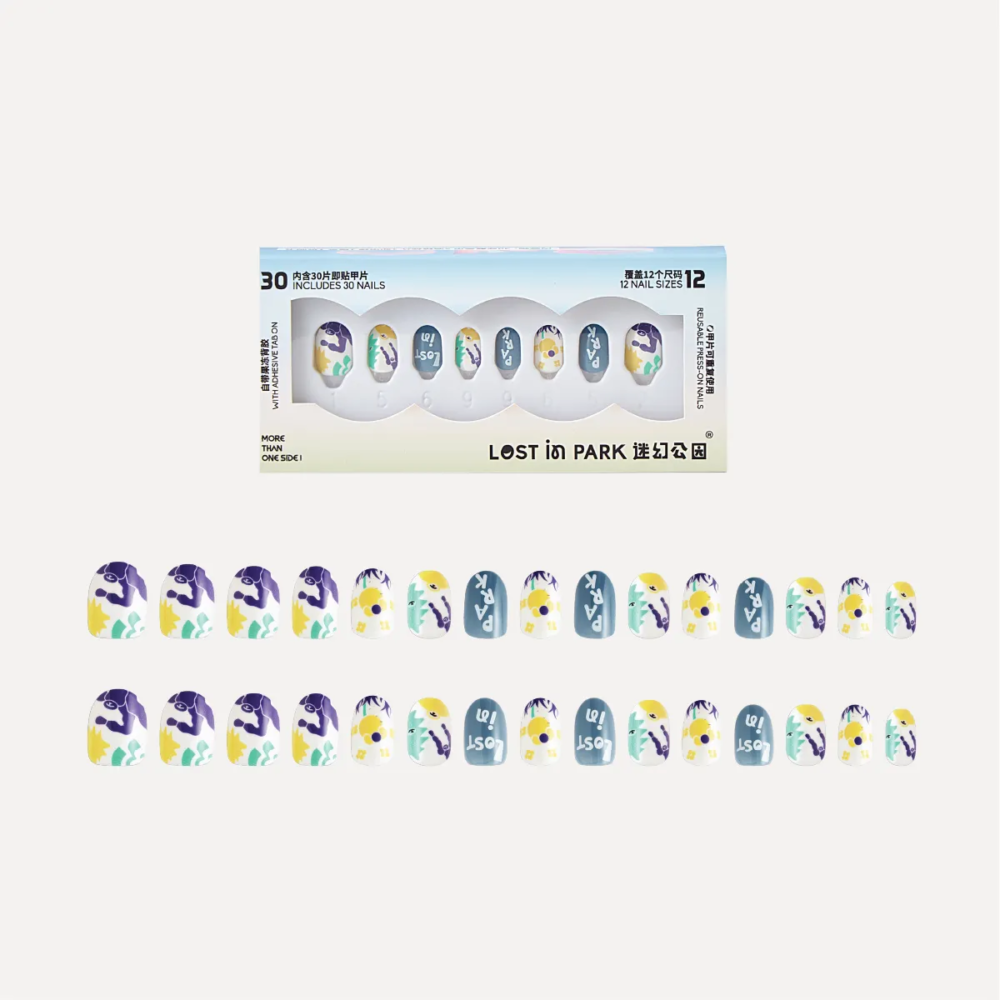 Day Dreaming press-on nail set with box and 30 assorted nails arranged in colorful floral and illustrated patterns