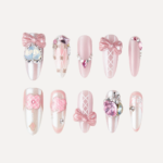 Crystal Ballet press-on nail set in long oval shape with pink bows and crystal embellishments