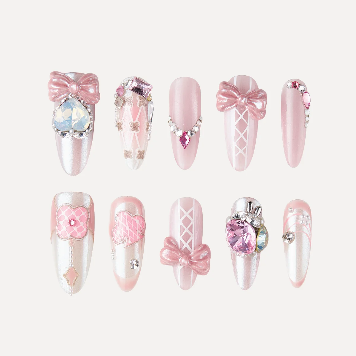 Crystal Ballet press-on nail set in long oval shape with pink bows and crystal embellishments