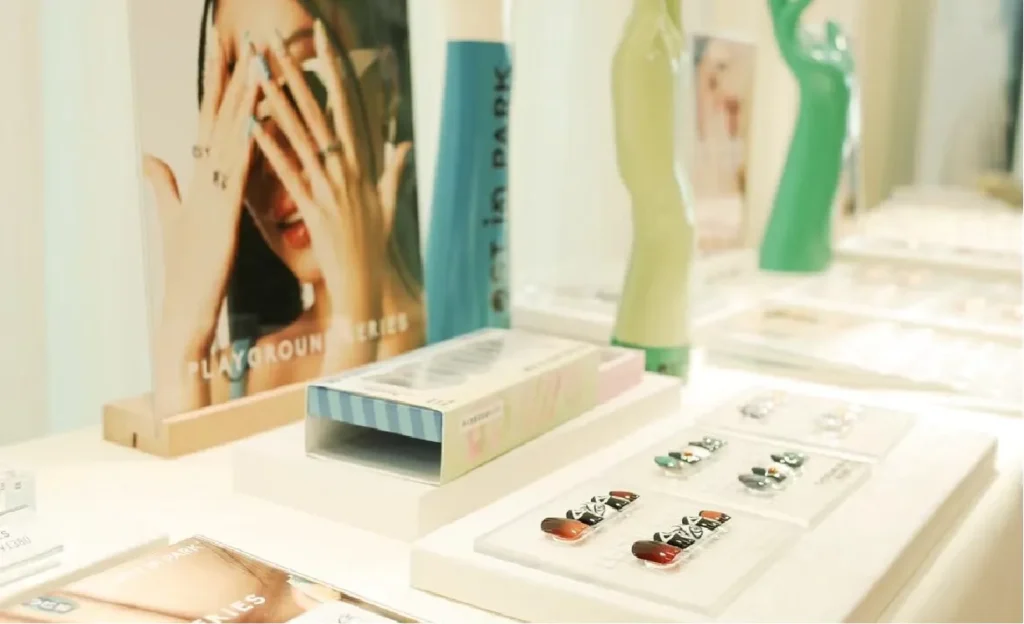 Display of LOST in PARK press-on nail sets and product packaging in fashion week