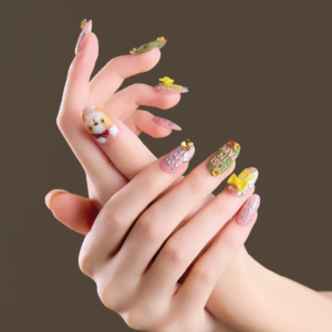 Short oval press on nails with cute character and bow details shown in dynamic hand pose