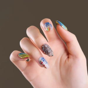 Close-up of short oval press-on nails with rainbow and graphic details