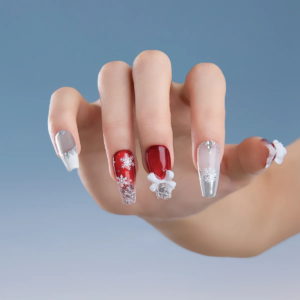 Red and silver Christmas press on nails medium coffin on hand