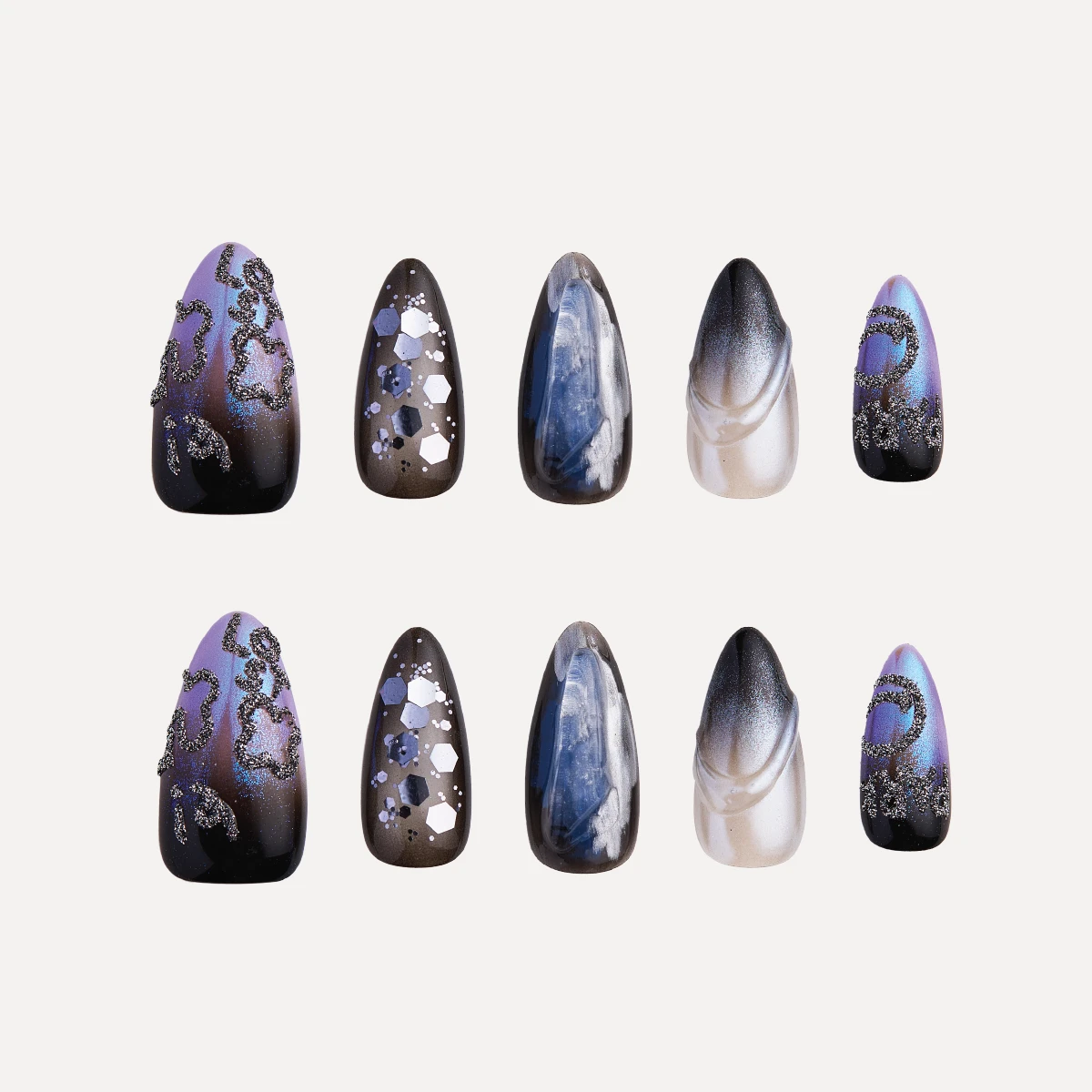Mystic Jewel medium almond press-on nail set with galaxy-inspired blue, black and silver designs