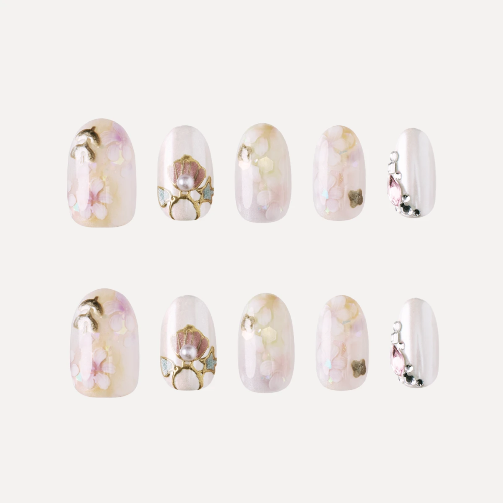 Short oval press on nail design set with floral and pearl details